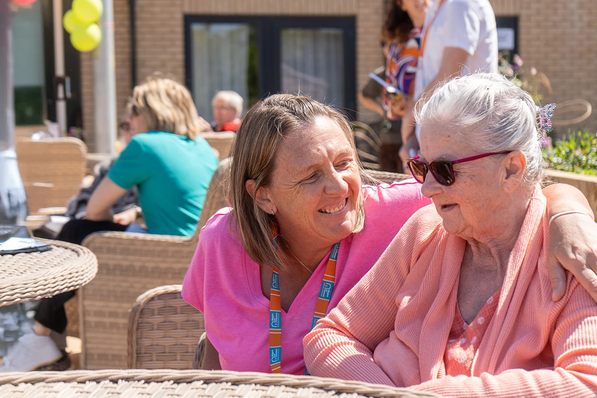 A Care Assistant and Client out and about together